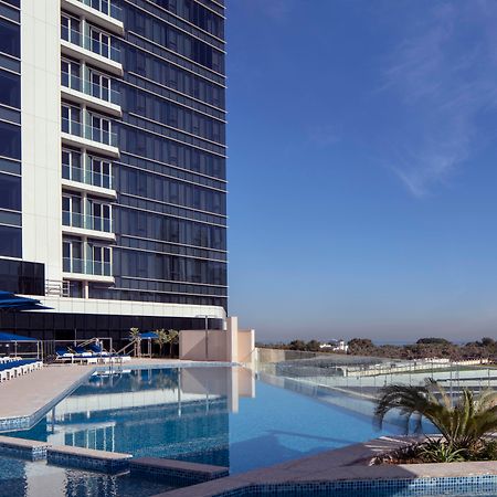 Avani Plus Palm View Dubai Hotel & Suites Exterior photo The swimming pool at the hotel