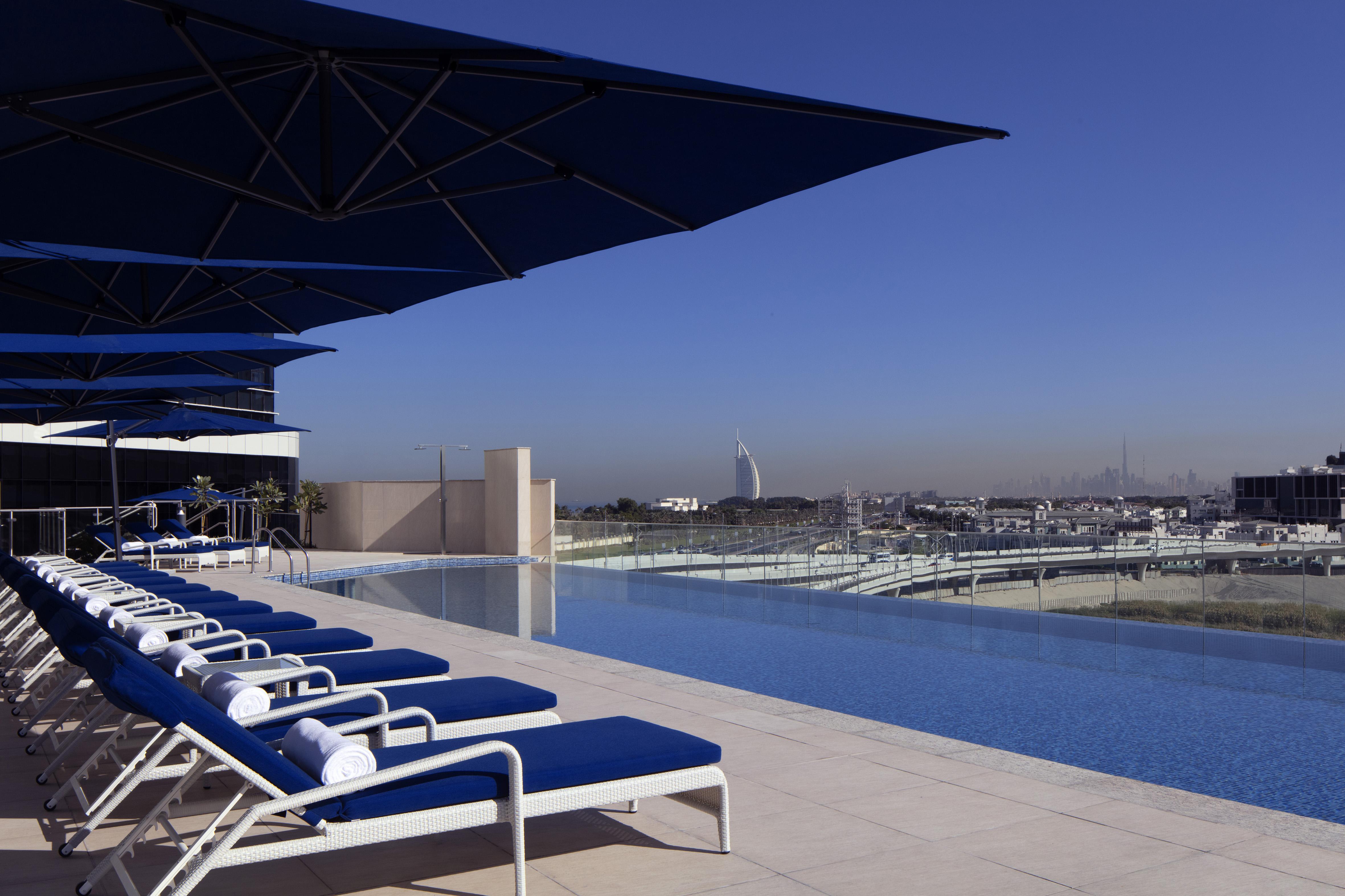 Avani Plus Palm View Dubai Hotel & Suites Exterior photo The pool at the Ritz-Carlton, DIFC