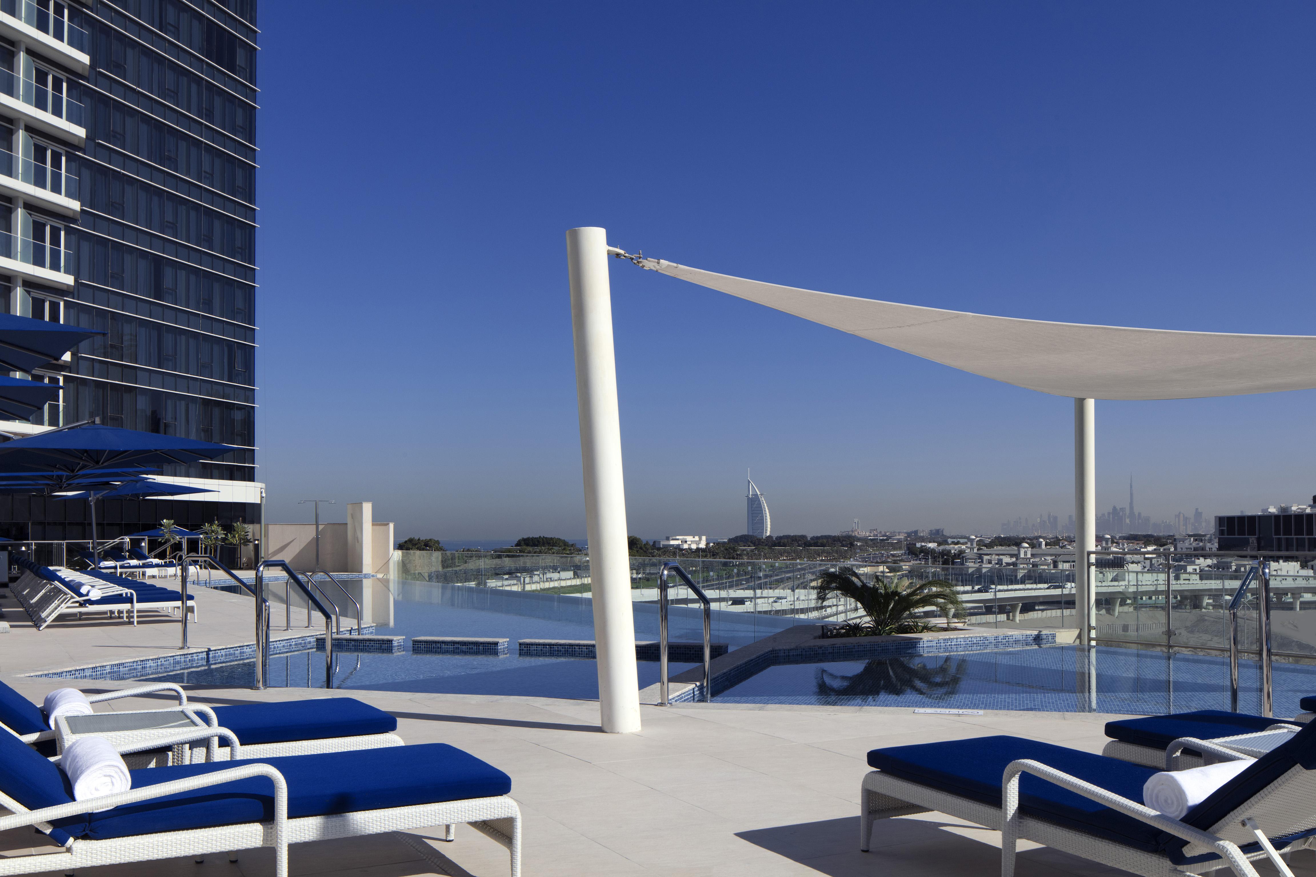 Avani Plus Palm View Dubai Hotel & Suites Exterior photo The pool deck at the InterContinental